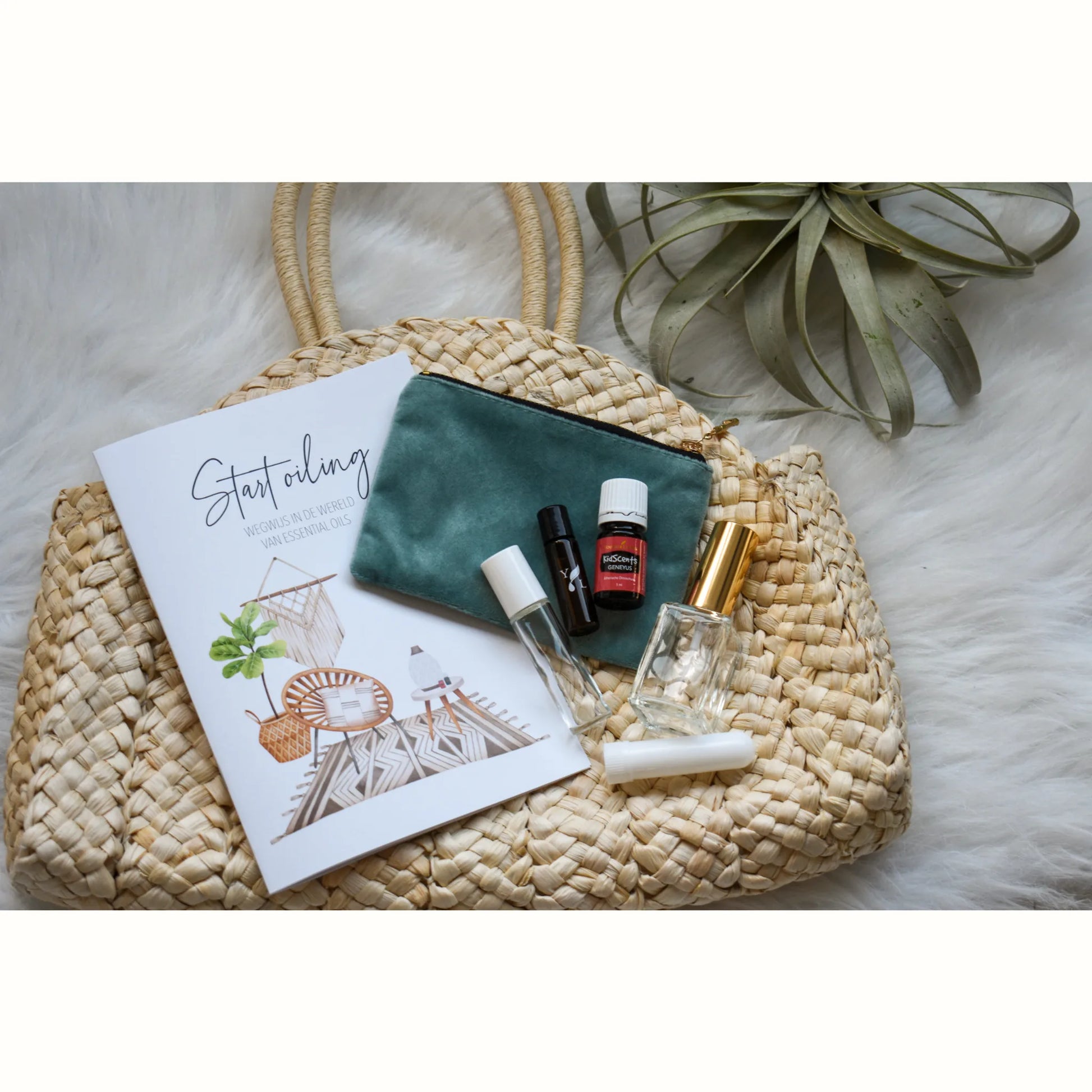 Starterkit van Young Living met essentiële olie, rollers, informatief boekje en stijlvolle accessoires – ideaal wellness kadopakket voor beginners in aromatherapie.