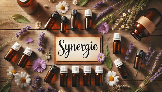 Flesjes etherische olie op houten plank met bloemen en kaart ‘synergie’ 
