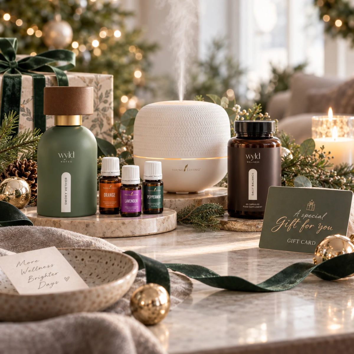 Kerstcadeaus met parfum, diffuser en essentiële oliën, wellnessproduct en cadeaukaart van Suzanne Shares.